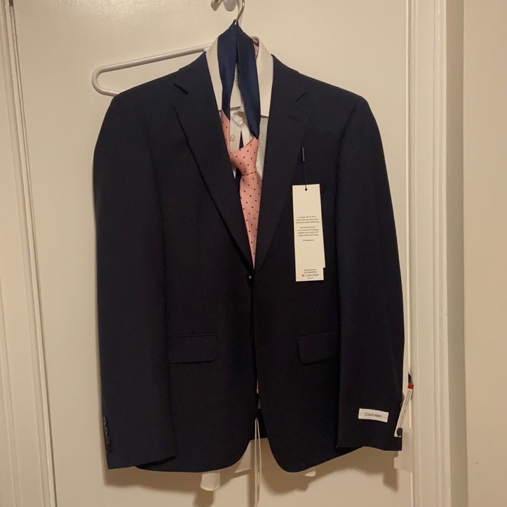 Navy blue suit blazer size 36s and pants 30L, 30W from Calvin Klein